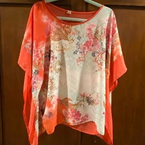 Coral-orange handkerchief top.
